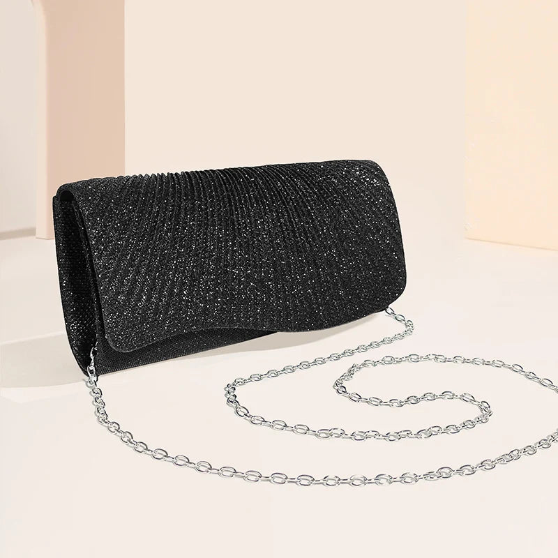 Clutch bag with sparkling studs and chain strap design