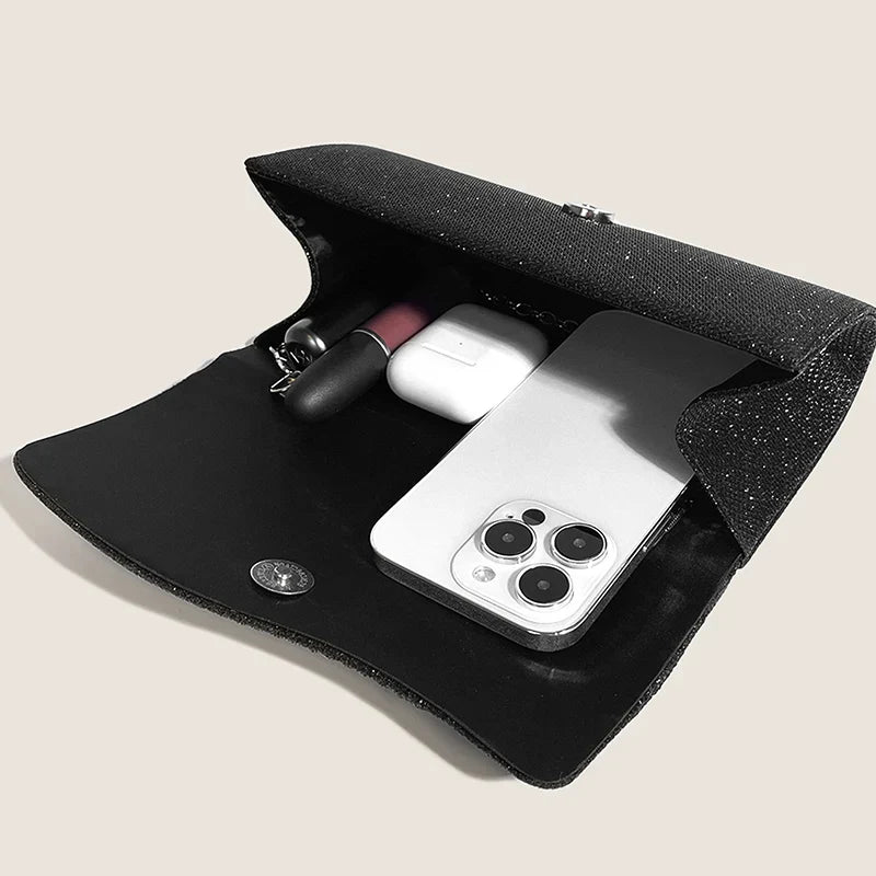 Clutch bag with sparkling studs and chain strap design
