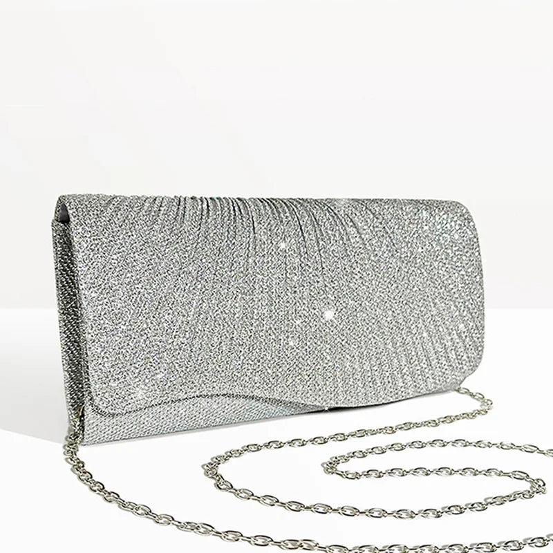 Clutch bag with sparkling studs and chain strap design